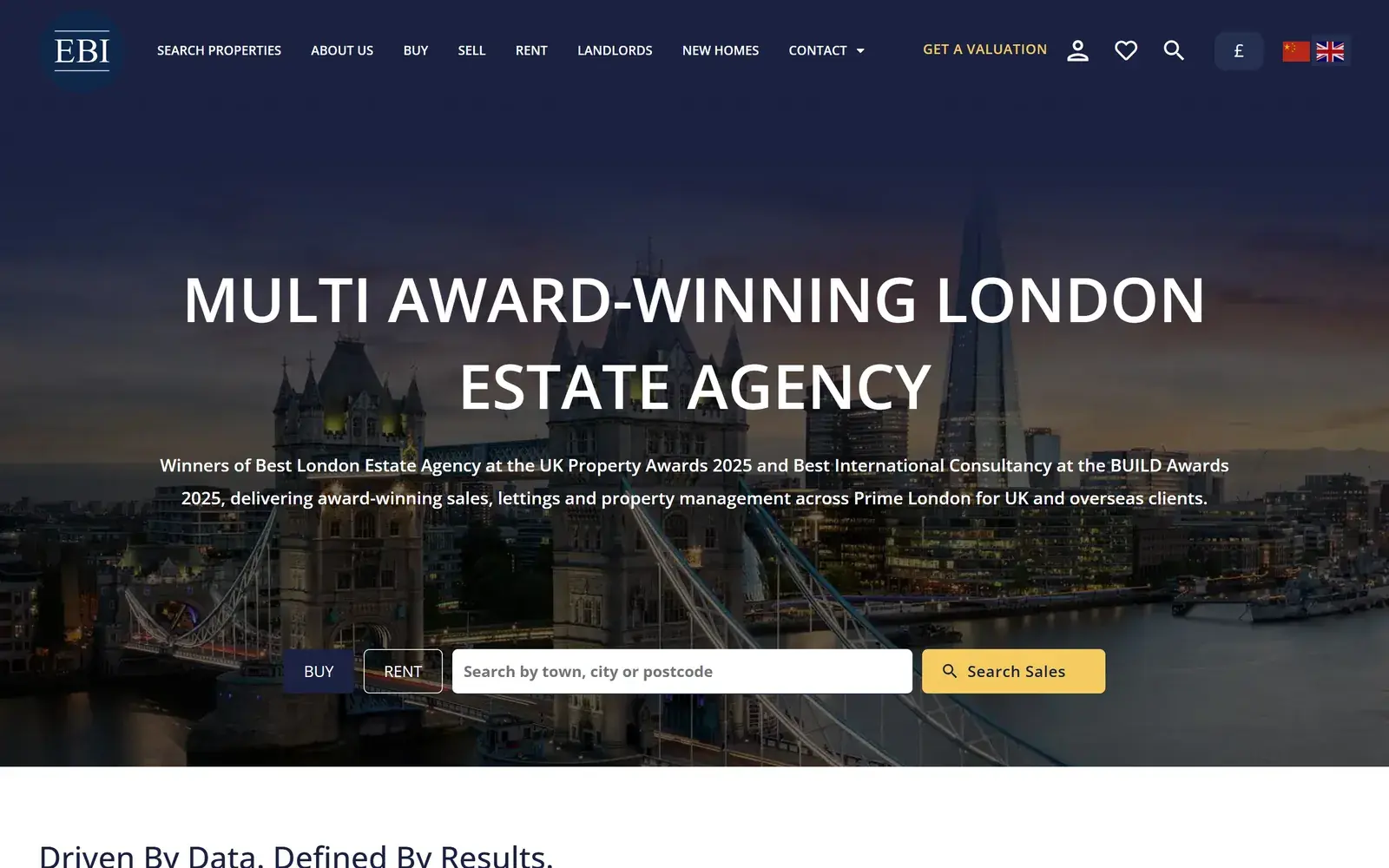 Ernest-Brooks International homepage on desktop, with the headline Multi Award-Winning London Estate Agency over a dusk view of Tower Bridge and the Shard, Buy and Rent tabs, a location search box and a yellow Search Sales button